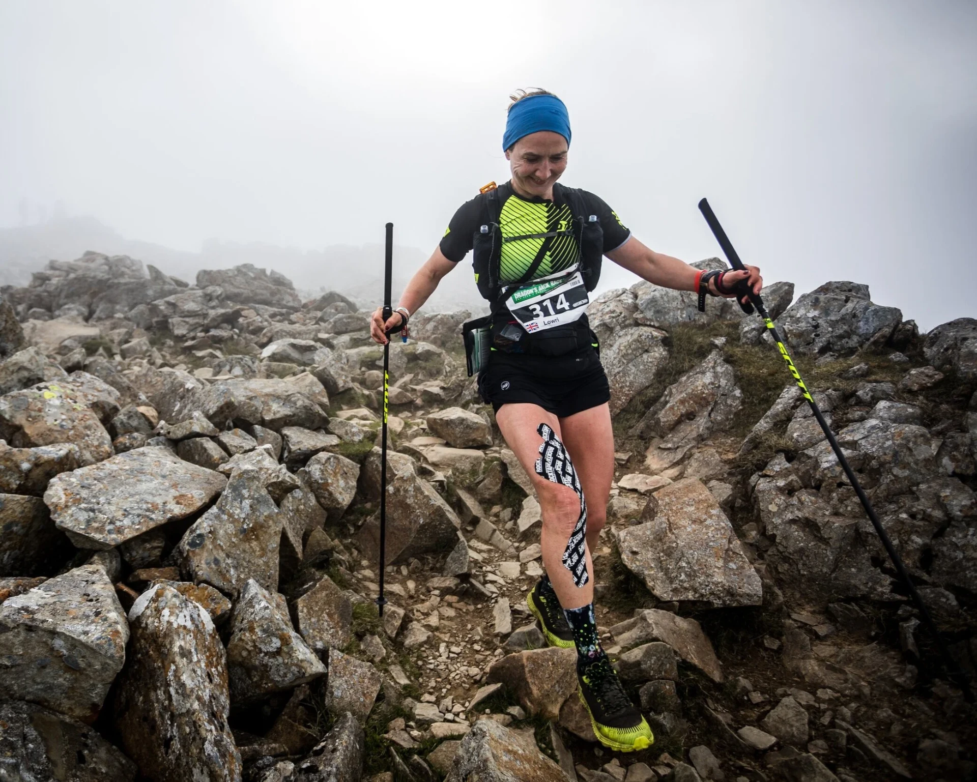 Lowri Morgan running the Dragon's Back Race across a rocky Welsh mountain ridge